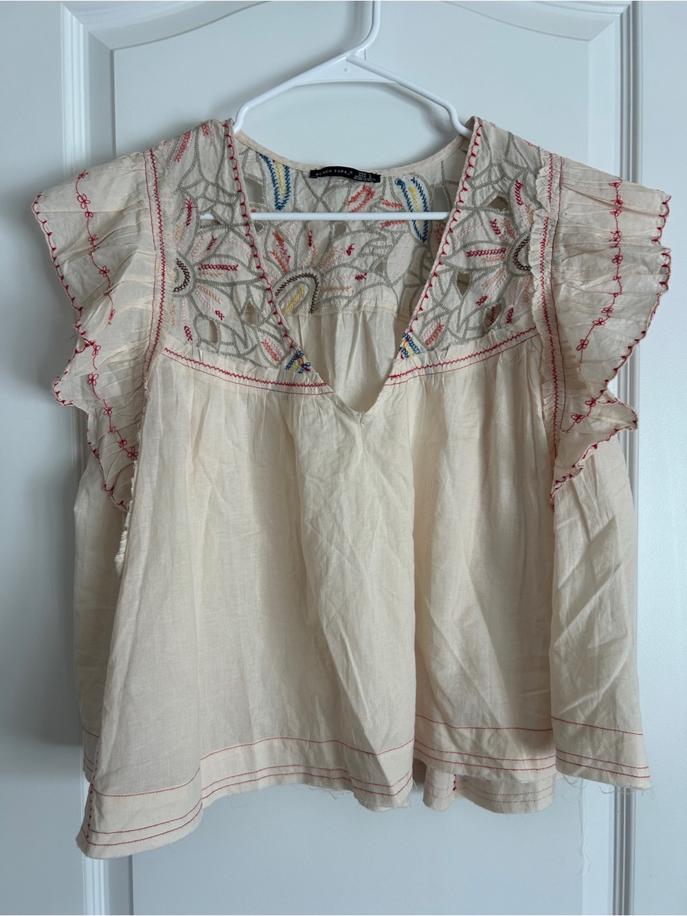 Black Tape_ Cream Embroidered Flutter Sleeve Tunic